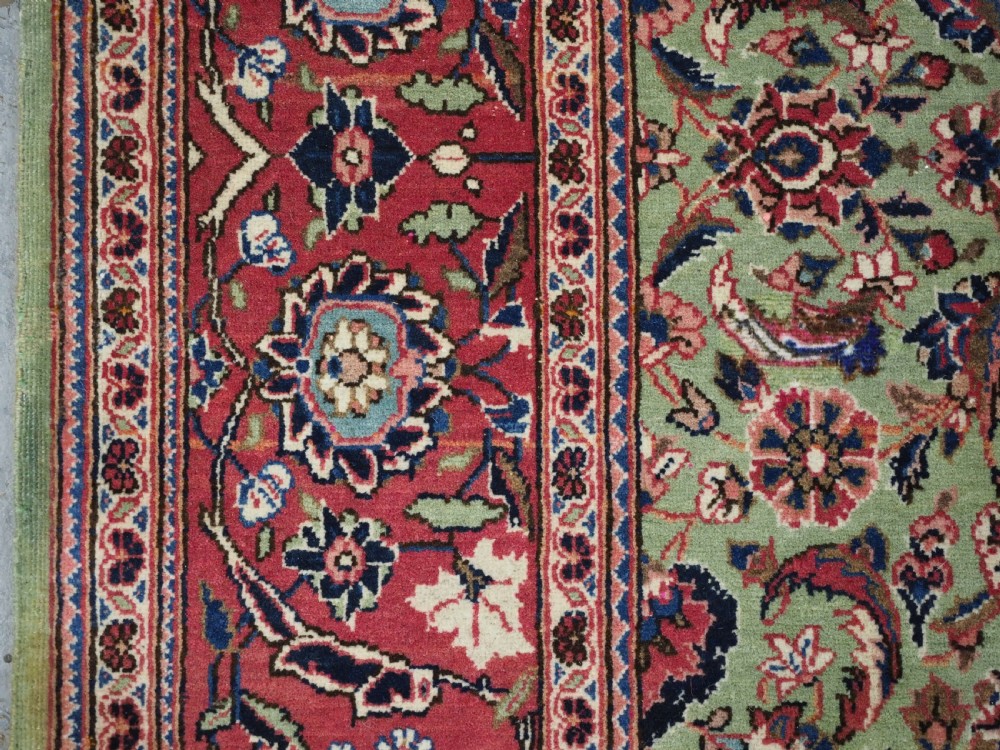 ANTIQUE KASHAN RUG WITH FINE FLORAL DESIGN ON A SCARCE GREEN GROUND, CIRCA 1900. View VII