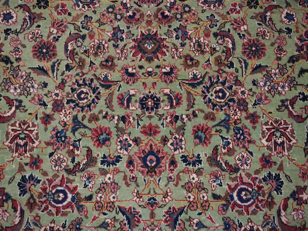 ANTIQUE KASHAN RUG WITH FINE FLORAL DESIGN ON A SCARCE GREEN GROUND, CIRCA 1900. View VIII