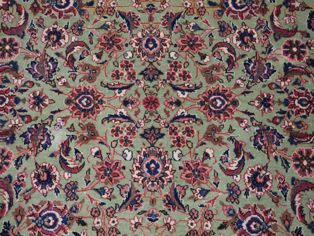ANTIQUE KASHAN RUG WITH FINE FLORAL DESIGN ON A SCARCE GREEN GROUND, CIRCA 1900. View IX