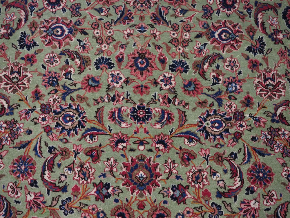 ANTIQUE KASHAN RUG WITH FINE FLORAL DESIGN ON A SCARCE GREEN GROUND, CIRCA 1900. View X