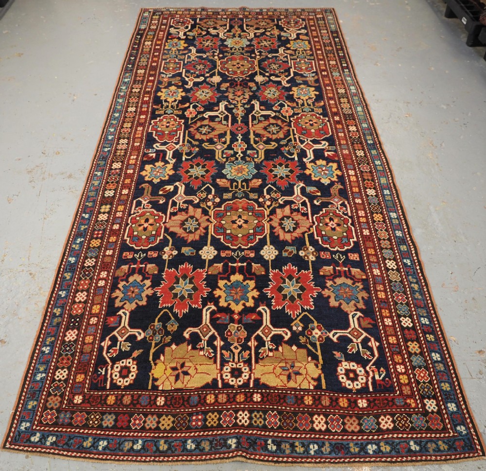 ANTIQUE CAUCASIAN SHIRVAN RUG WITH KUBA AFSHAN DESIGN, CIRCA 1900.