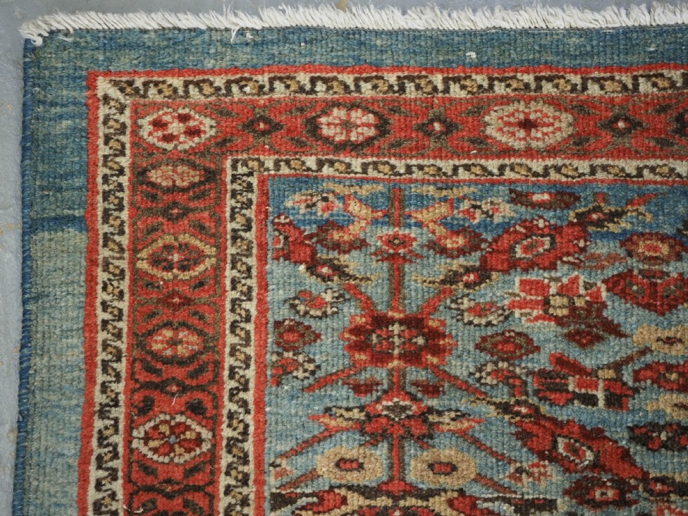 ANTIQUE ZIEGLER RUG WITH SHRUB DESIGN, POWDER BLUE GROUND, CIRCA 1890. View VII