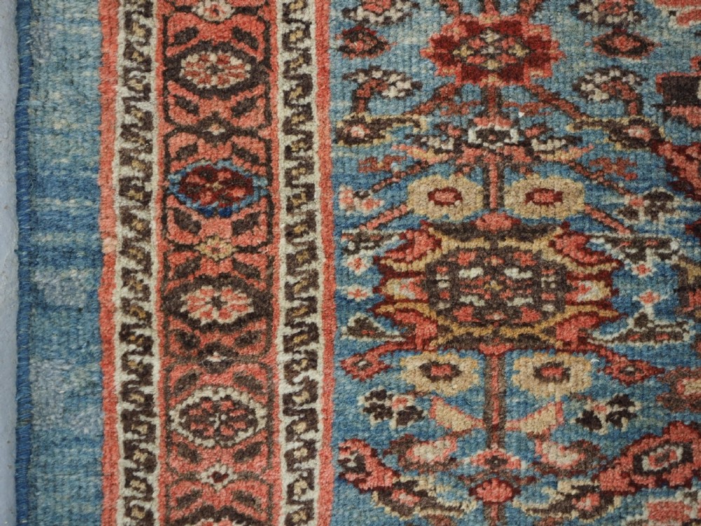 ANTIQUE ZIEGLER RUG WITH SHRUB DESIGN, POWDER BLUE GROUND, CIRCA 1890. View VIII