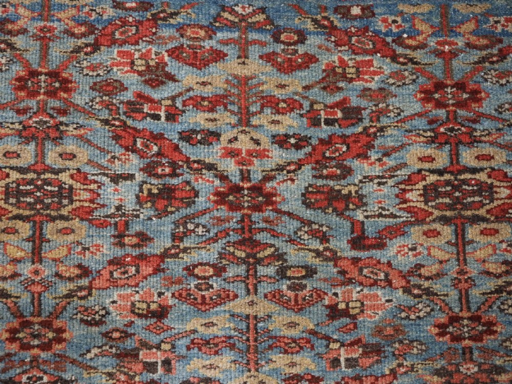 ANTIQUE ZIEGLER RUG WITH SHRUB DESIGN, POWDER BLUE GROUND, CIRCA 1890. View IX