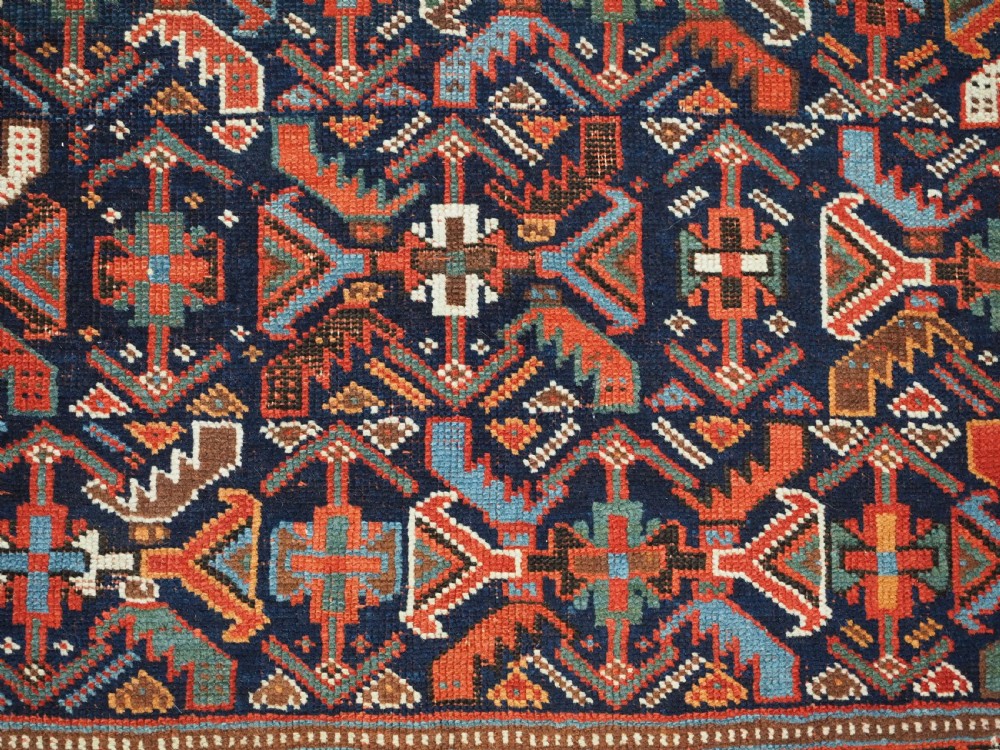 An antique hand-knotted wool Afshar rug featuring an all-over geometric Herati design on a dark navy blue field with a patterned cream border. View XI