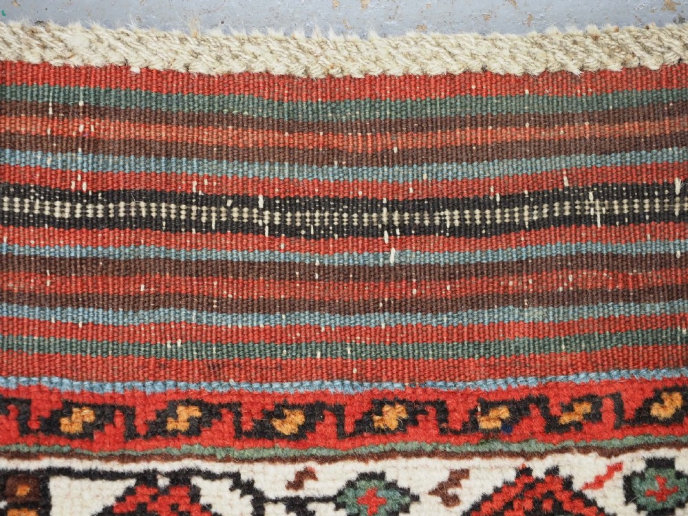 An antique hand-knotted wool Afshar rug featuring an all-over geometric Herati design on a dark navy blue field with a patterned cream border. View XIII