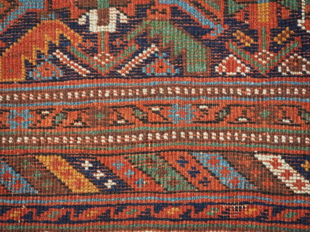 An antique hand-knotted wool Afshar rug featuring an all-over geometric Herati design on a dark navy blue field with a patterned cream border. View XIV