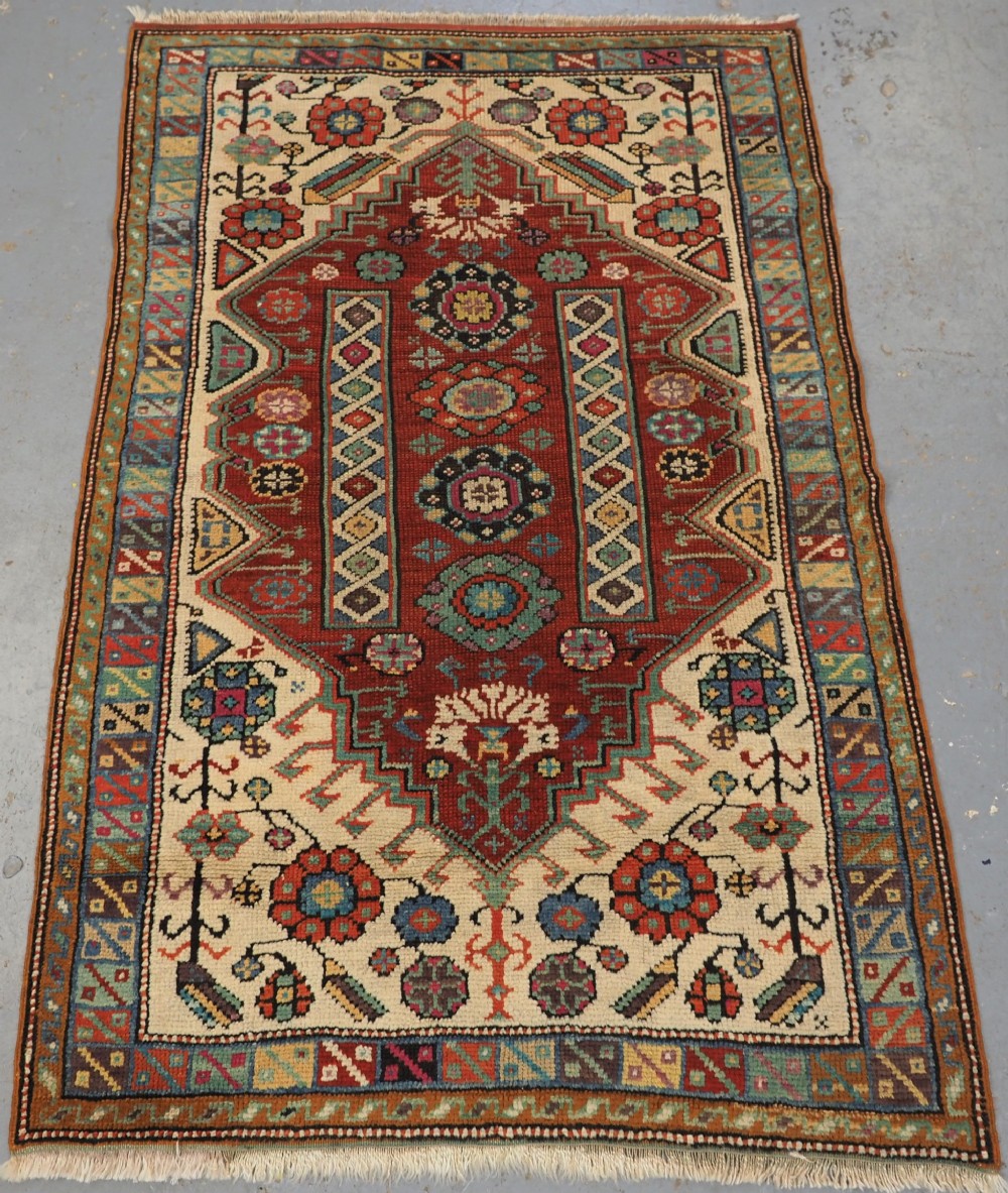ANTIQUE TURKISH MIHALICIK VILLAGE RUG, FLORAL DESIGN, CIRCA 1900.
