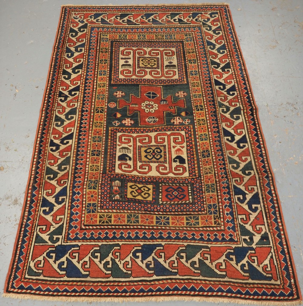 ANTIQUE CAUCASIAN KARACHOV KAZAK, GREEN GROUND, CIRCA 1880.