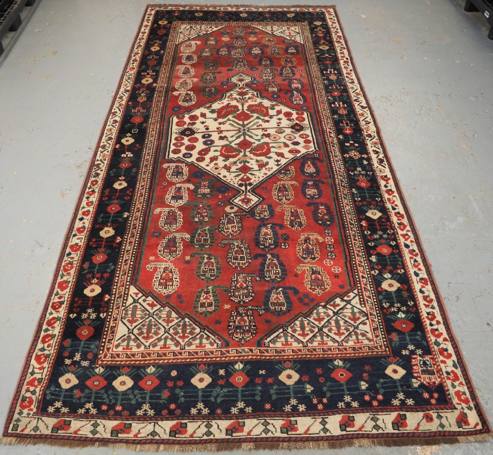 ANTIQUE TRIBAL KHAMSEH RUG WITH BOTEH AND POMEGRANATE DESIGN, CIRCA 1860.