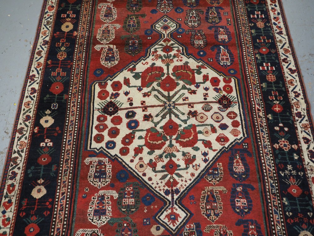 ANTIQUE TRIBAL KHAMSEH RUG WITH BOTEH AND POMEGRANATE DESIGN, CIRCA 1860. View IV
