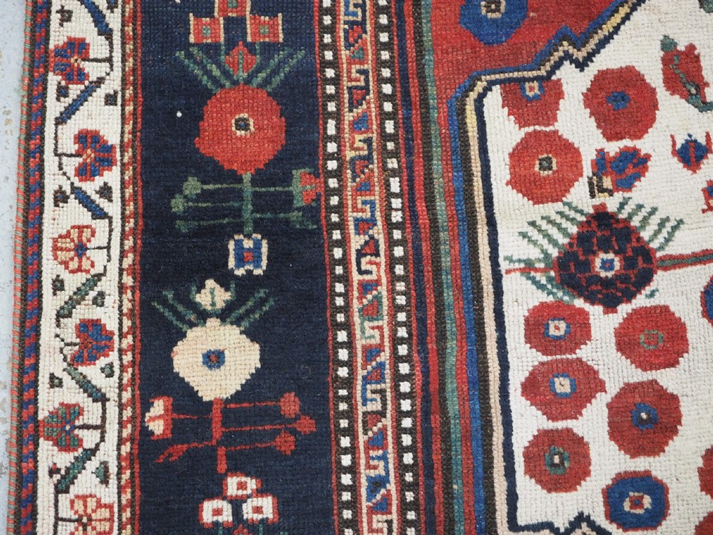 ANTIQUE TRIBAL KHAMSEH RUG WITH BOTEH AND POMEGRANATE DESIGN, CIRCA 1860. View VII