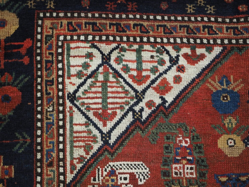 ANTIQUE TRIBAL KHAMSEH RUG WITH BOTEH AND POMEGRANATE DESIGN, CIRCA 1860. View VIII