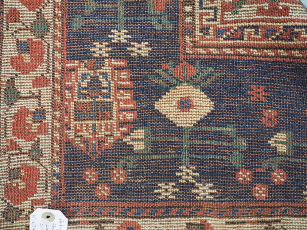 ANTIQUE TRIBAL KHAMSEH RUG WITH BOTEH AND POMEGRANATE DESIGN, CIRCA 1860. View XV