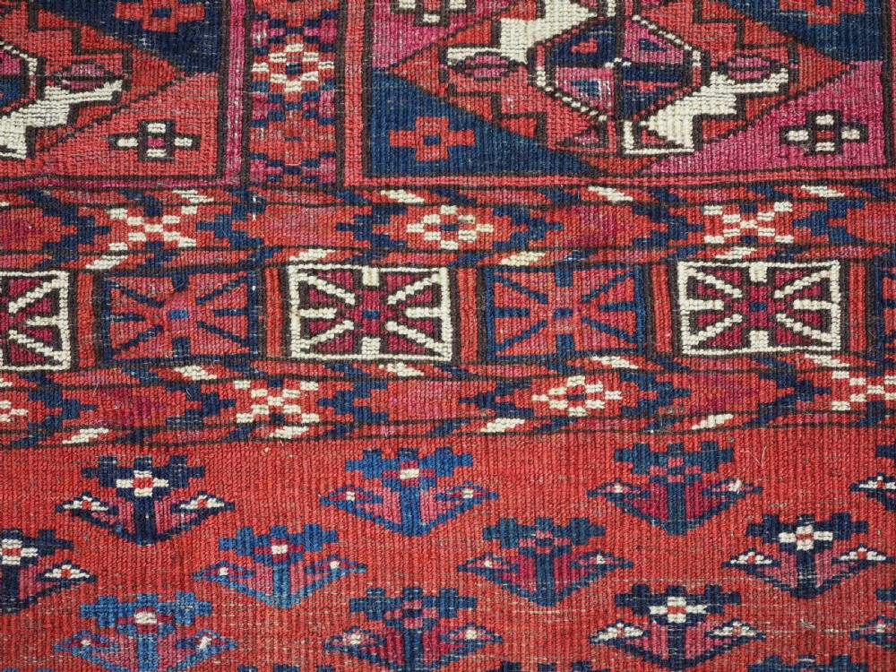EXCEPTIONAL PAIR OF ANTIQUE TEKKE TURKMEN CHUVAL FACES, SILK HIGHLIGHTS, MID 19TH CENTURY. View V