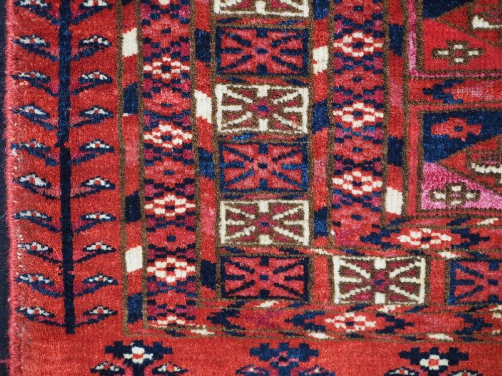 EXCEPTIONAL PAIR OF ANTIQUE TEKKE TURKMEN CHUVAL FACES, SILK HIGHLIGHTS, MID 19TH CENTURY. View XII