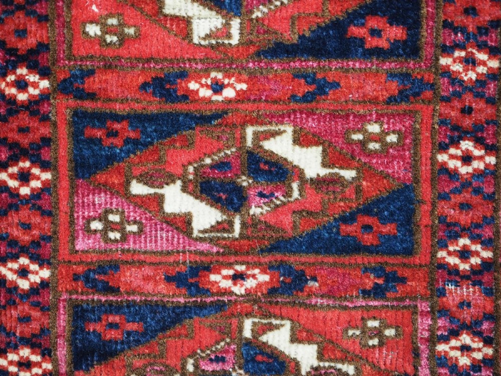 EXCEPTIONAL PAIR OF ANTIQUE TEKKE TURKMEN CHUVAL FACES, SILK HIGHLIGHTS, MID 19TH CENTURY. View XIV