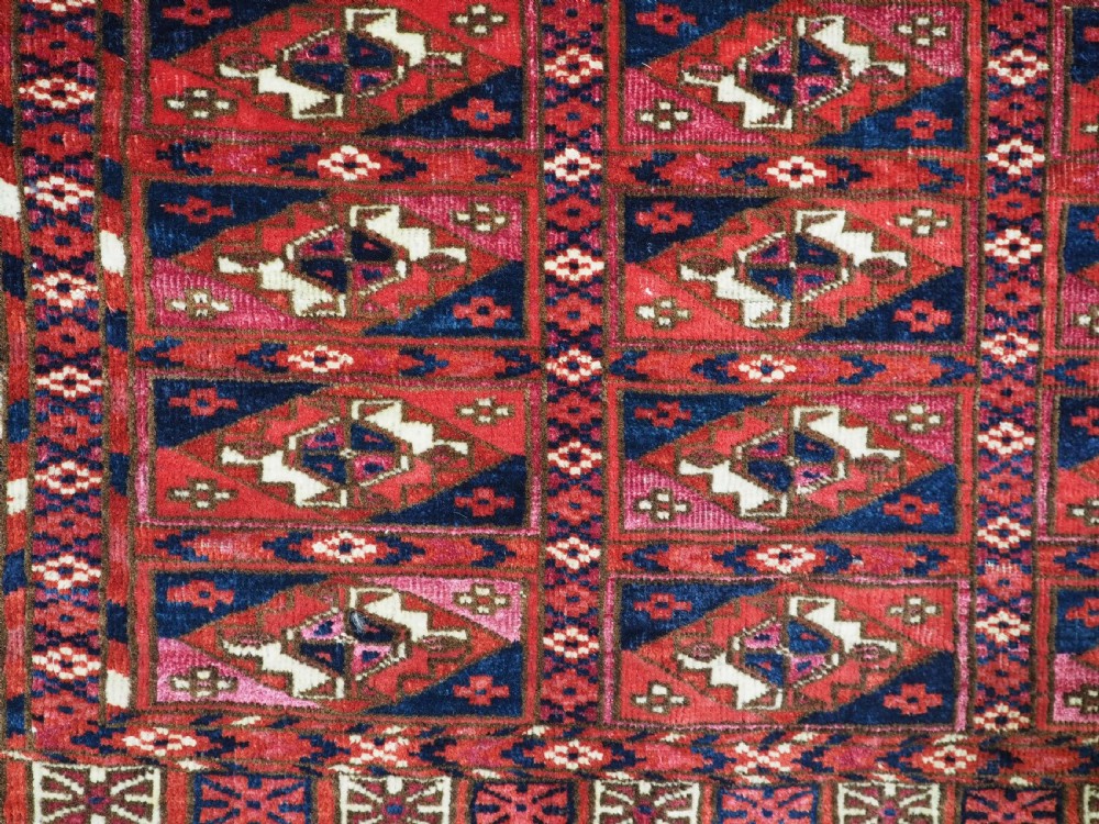 EXCEPTIONAL PAIR OF ANTIQUE TEKKE TURKMEN CHUVAL FACES, SILK HIGHLIGHTS, MID 19TH CENTURY. View XV