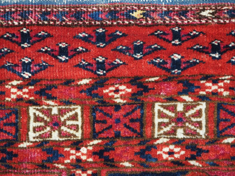 EXCEPTIONAL PAIR OF ANTIQUE TEKKE TURKMEN CHUVAL FACES, SILK HIGHLIGHTS, MID 19TH CENTURY. View XVI