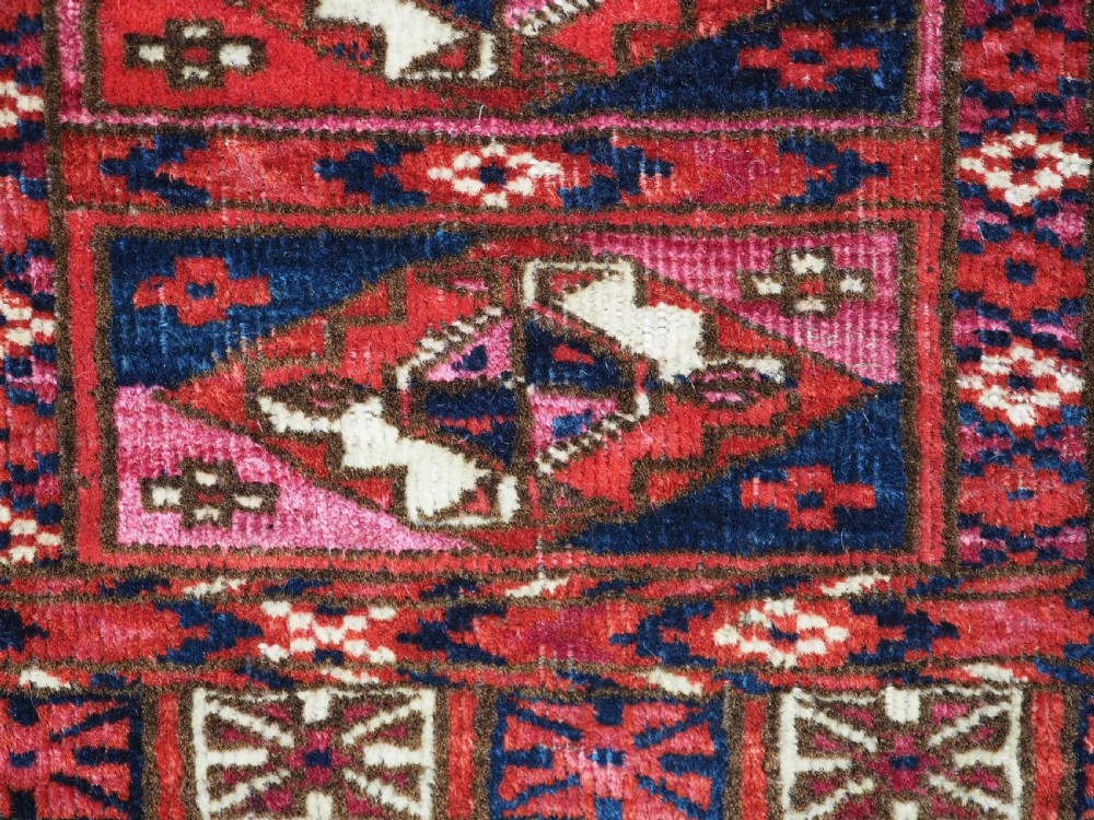 EXCEPTIONAL PAIR OF ANTIQUE TEKKE TURKMEN CHUVAL FACES, SILK HIGHLIGHTS, MID 19TH CENTURY. View XVII