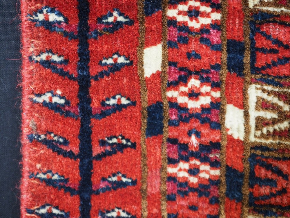 EXCEPTIONAL PAIR OF ANTIQUE TEKKE TURKMEN CHUVAL FACES, SILK HIGHLIGHTS, MID 19TH CENTURY. View XVIII