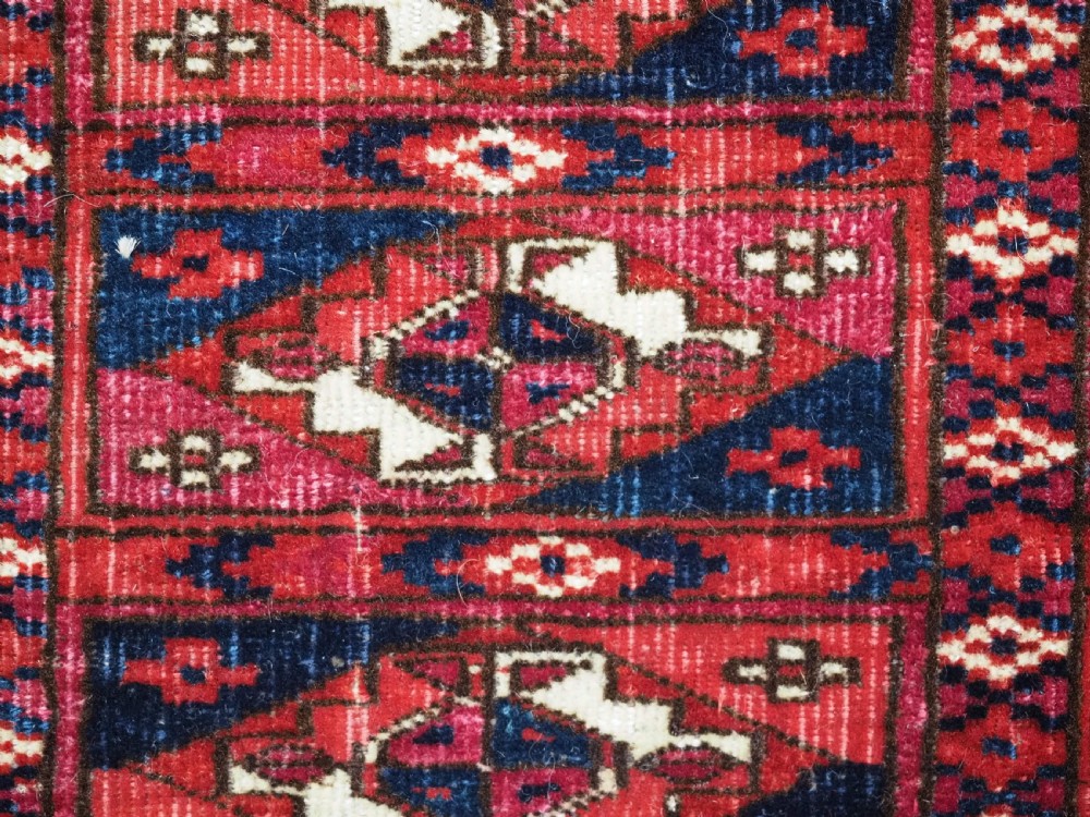 EXCEPTIONAL PAIR OF ANTIQUE TEKKE TURKMEN CHUVAL FACES, SILK HIGHLIGHTS, MID 19TH CENTURY. View XXI