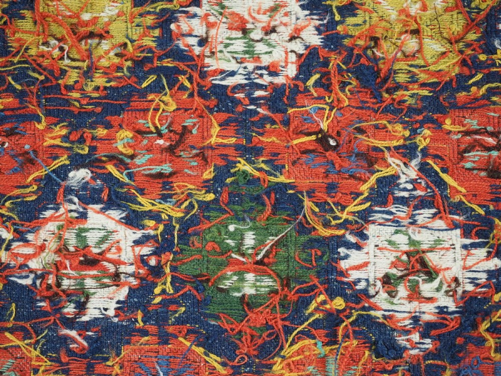 An antique square Shahsavan wool bag face featuring geometric tribal motifs woven in Soumak flatweave technique with red, blue, green, and cream hues. View XI