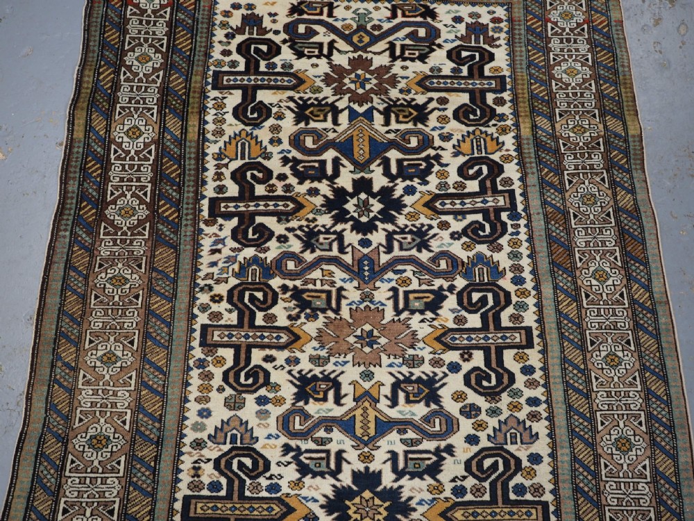 ANTIQUE CAUCASIAN KUBA REGION WHITE GROUND PEREPEDIL RUG, CIRCA 1890. View III