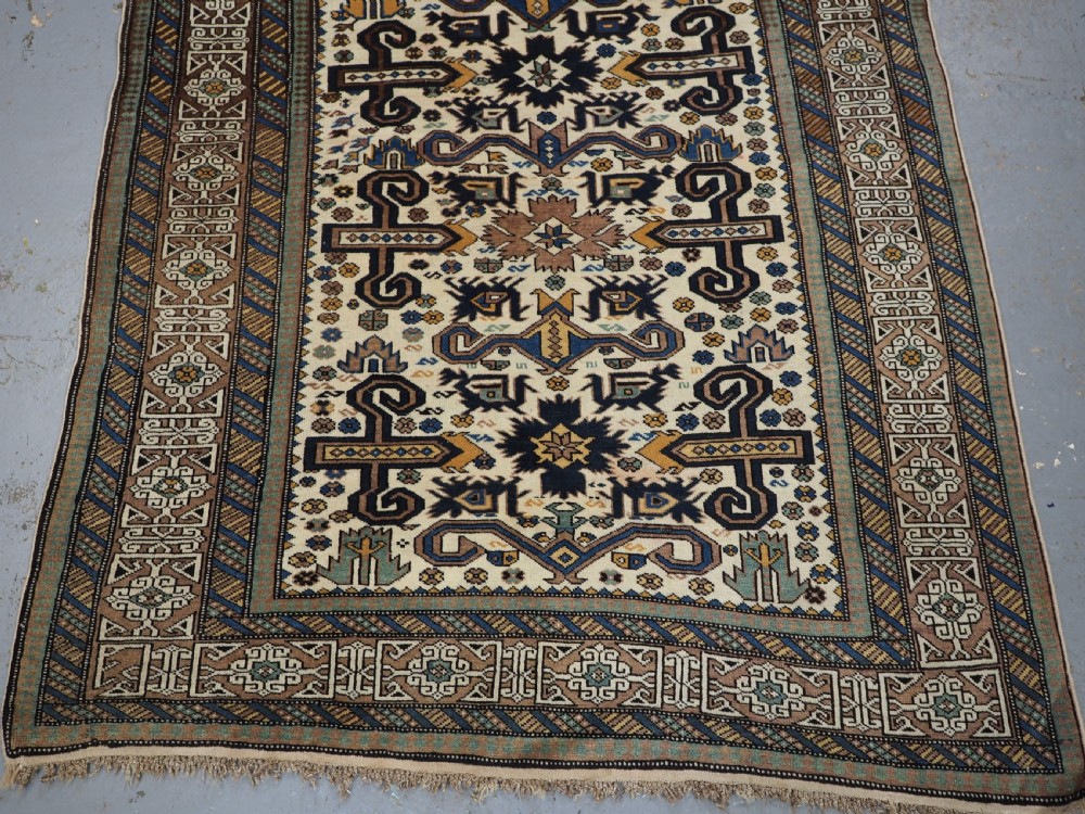 ANTIQUE CAUCASIAN KUBA REGION WHITE GROUND PEREPEDIL RUG, CIRCA 1890. View IV