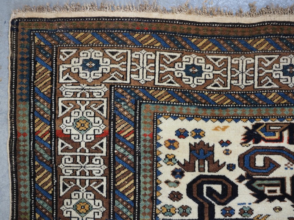 ANTIQUE CAUCASIAN KUBA REGION WHITE GROUND PEREPEDIL RUG, CIRCA 1890. View V