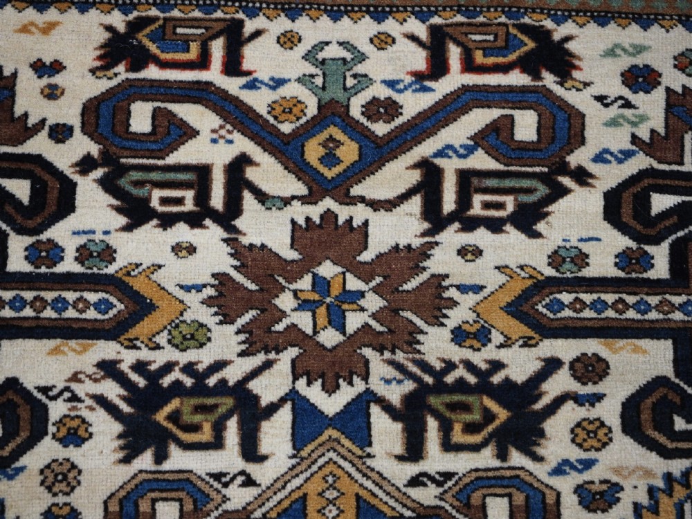 ANTIQUE CAUCASIAN KUBA REGION WHITE GROUND PEREPEDIL RUG, CIRCA 1890. View VI