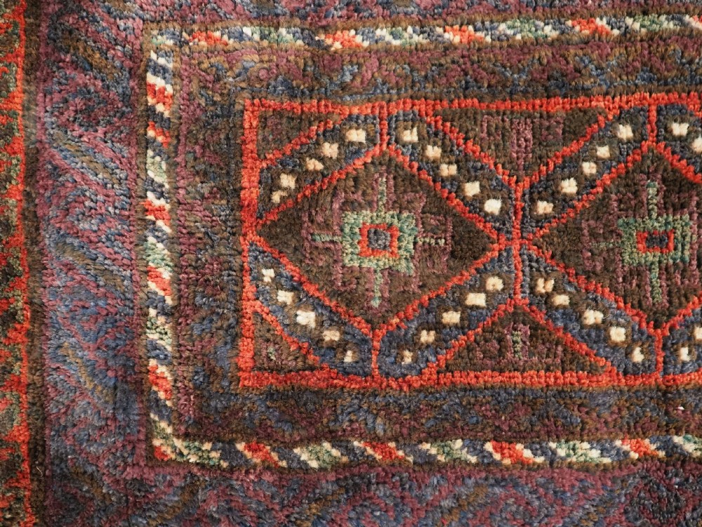 ANTIQUE AFGHAN TRIBAL STORAGE BAG COMPLETE WITH TASSELS, CIRCA 1920. View III