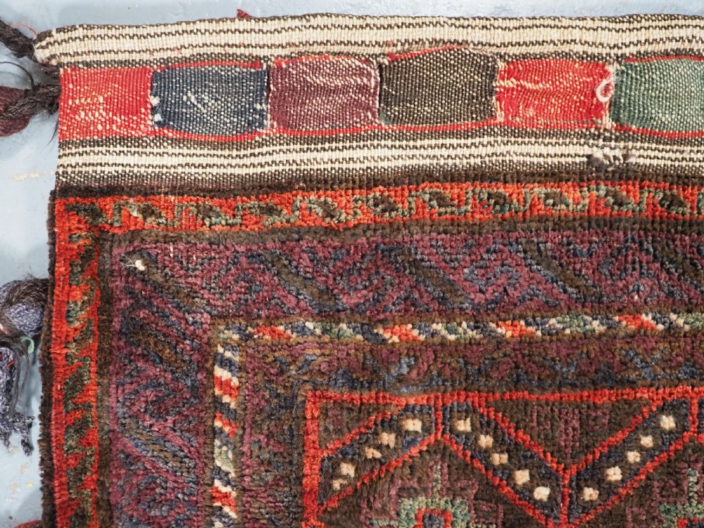 ANTIQUE AFGHAN TRIBAL STORAGE BAG COMPLETE WITH TASSELS, CIRCA 1920. View VI