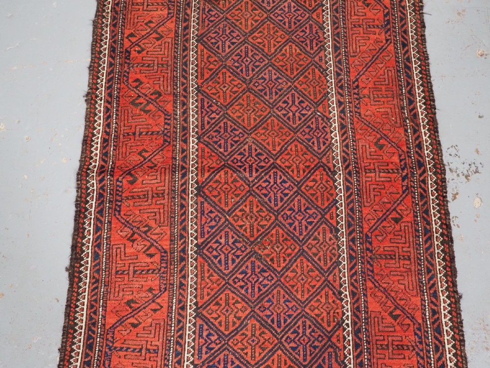 ANTIQUE AFGHAN BALUCH RUG WITH LATTICE DESIGN, CIRCA 1900. View IV