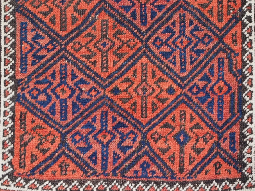 ANTIQUE AFGHAN BALUCH RUG WITH LATTICE DESIGN, CIRCA 1900. View VIII