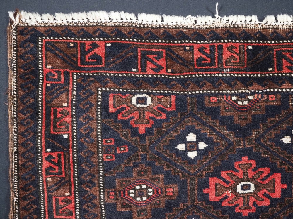 ANTIQUE BALUCH SADDLE BAG FACE WITH SNOWFLAKE DESIGN, CIRCA 1900. View II