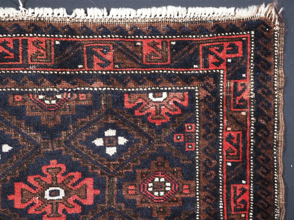 ANTIQUE BALUCH SADDLE BAG FACE WITH SNOWFLAKE DESIGN, CIRCA 1900. View III