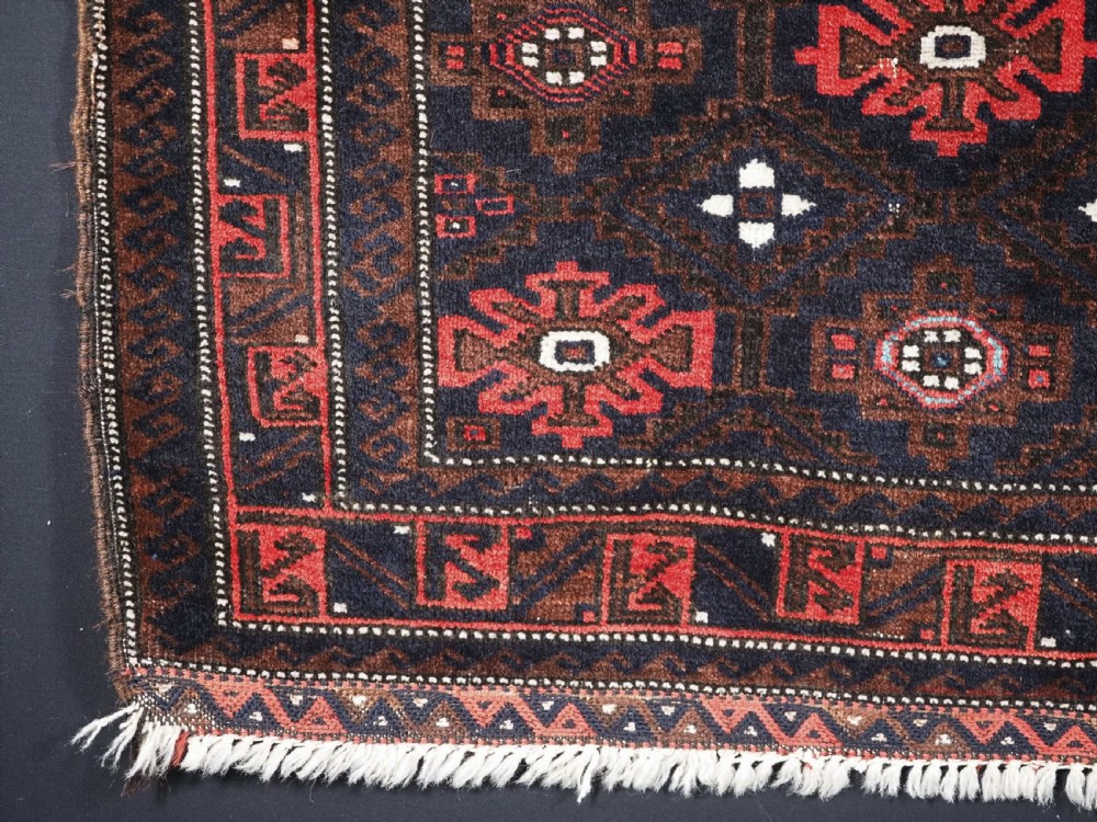 ANTIQUE BALUCH SADDLE BAG FACE WITH SNOWFLAKE DESIGN, CIRCA 1900. View IV