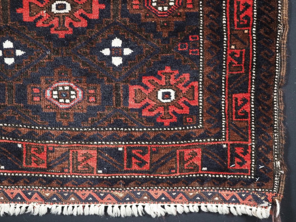 ANTIQUE BALUCH SADDLE BAG FACE WITH SNOWFLAKE DESIGN, CIRCA 1900. View V