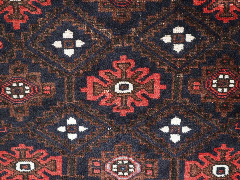 ANTIQUE BALUCH SADDLE BAG FACE WITH SNOWFLAKE DESIGN, CIRCA 1900. View VI