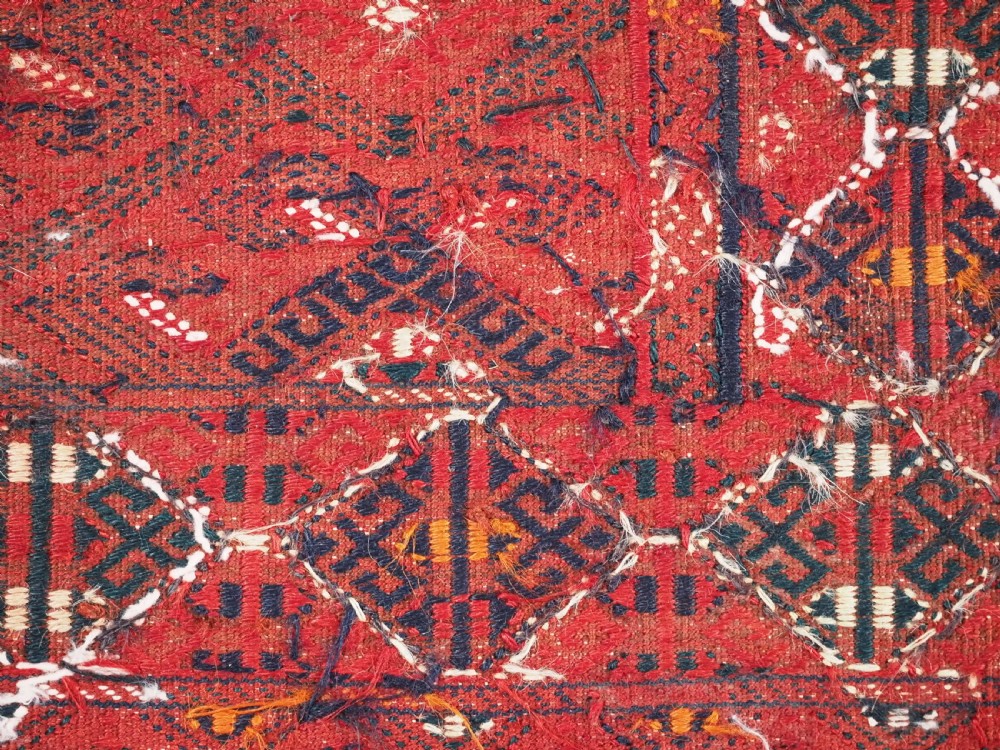 A large rectangular deep red wool flatweave carpet featuring an all-over diamond lattice pattern with detailed geometric borders and palas ends. View VIII