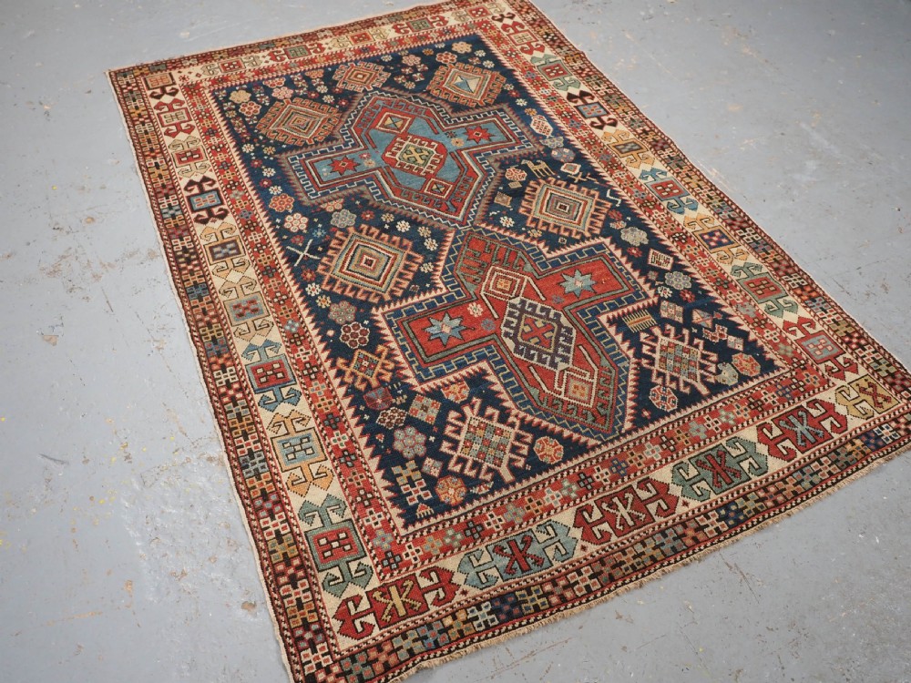ANTIQUE CAUCASIAN AKSTAFA RUG WITH BOLD MEDALLION DESIGN, CIRCA 1890. View II