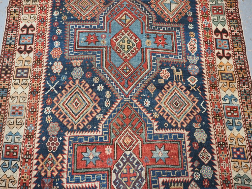 ANTIQUE CAUCASIAN AKSTAFA RUG WITH BOLD MEDALLION DESIGN, CIRCA 1890. View IV