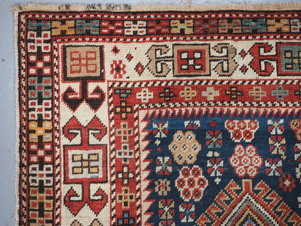 ANTIQUE CAUCASIAN AKSTAFA RUG WITH BOLD MEDALLION DESIGN, CIRCA 1890. View VI