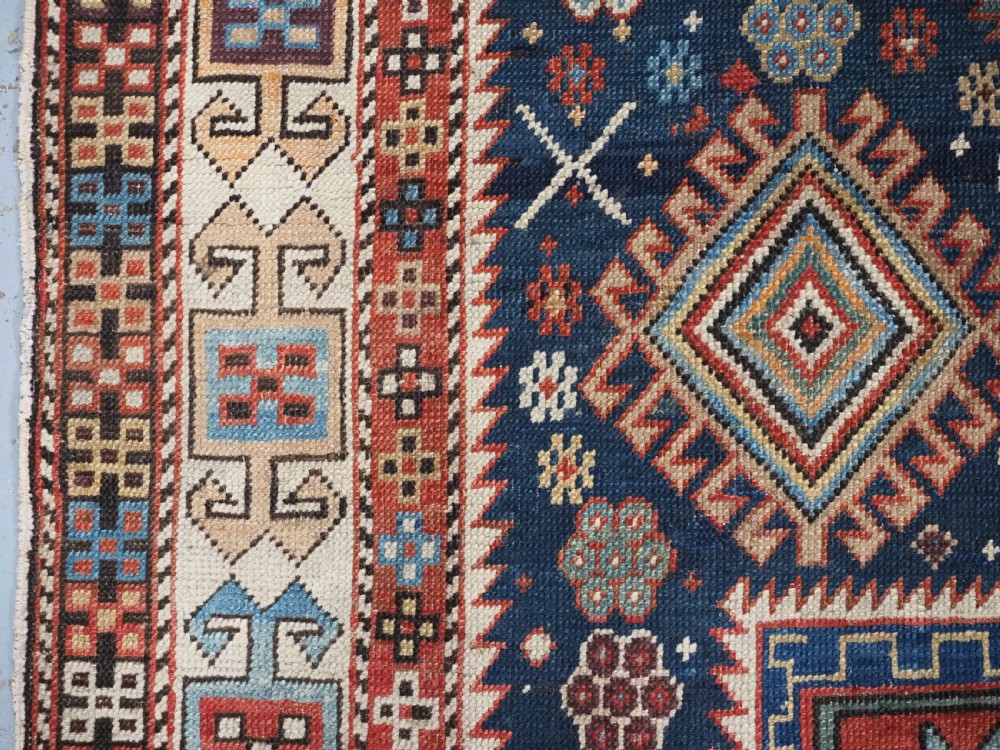 ANTIQUE CAUCASIAN AKSTAFA RUG WITH BOLD MEDALLION DESIGN, CIRCA 1890. View VII