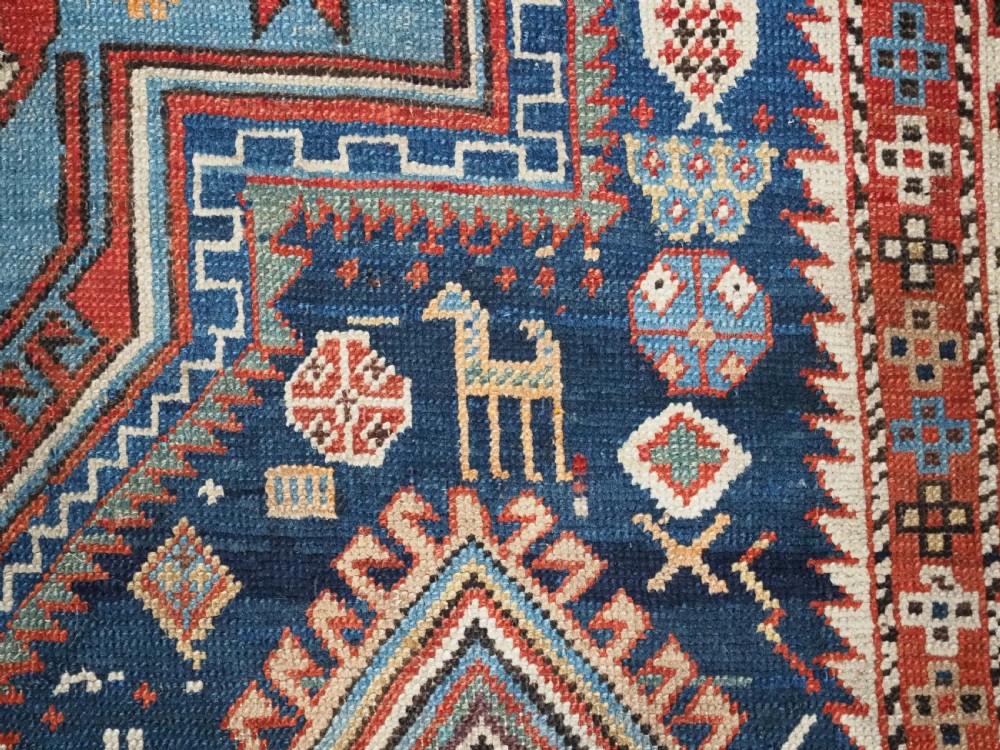 ANTIQUE CAUCASIAN AKSTAFA RUG WITH BOLD MEDALLION DESIGN, CIRCA 1890. View X