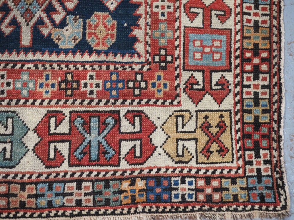 ANTIQUE CAUCASIAN AKSTAFA RUG WITH BOLD MEDALLION DESIGN, CIRCA 1890. View XII
