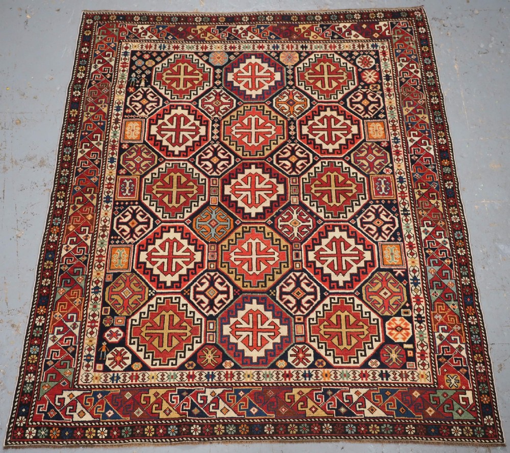 ANTIQUE CAUCASIAN SHIRVAN RUG WITH OCTAGON LATTICE DESIGN, CIRCA 1890.