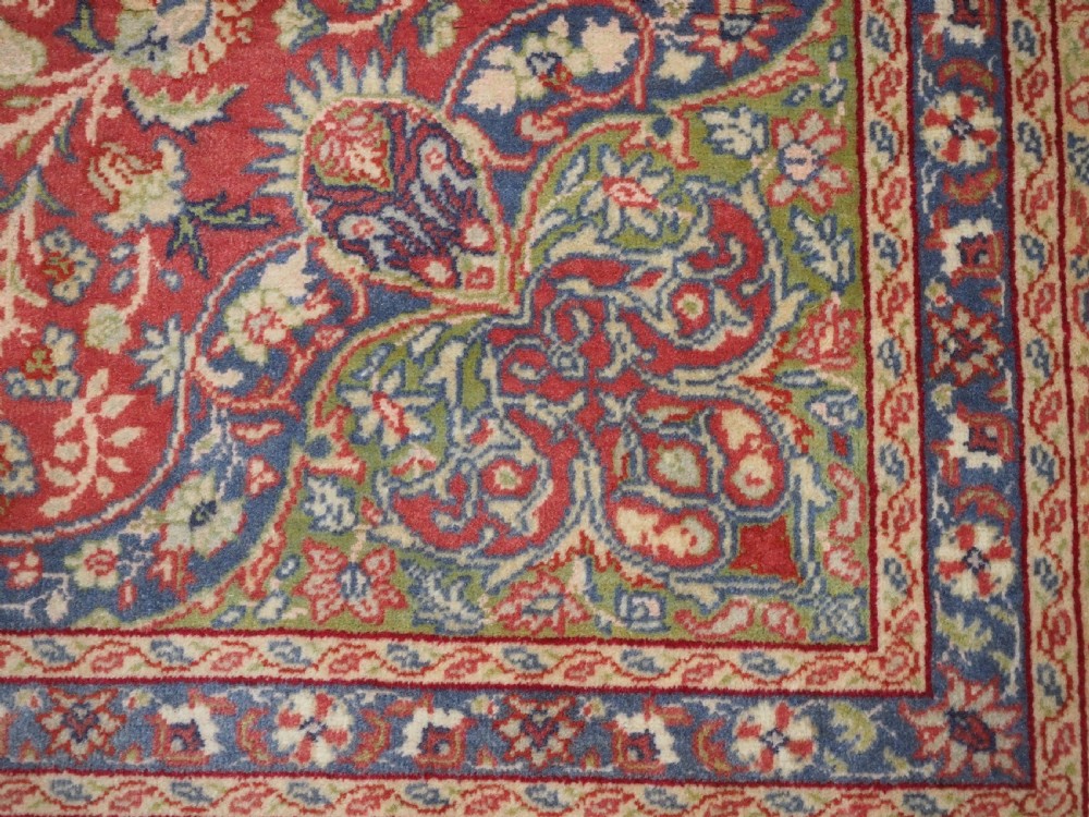 An antique Anatolian Sivas hand-knotted wool rug featuring a central cream medallion surrounded by a red field with floral arabesques and multi-tiered borders. View XIII