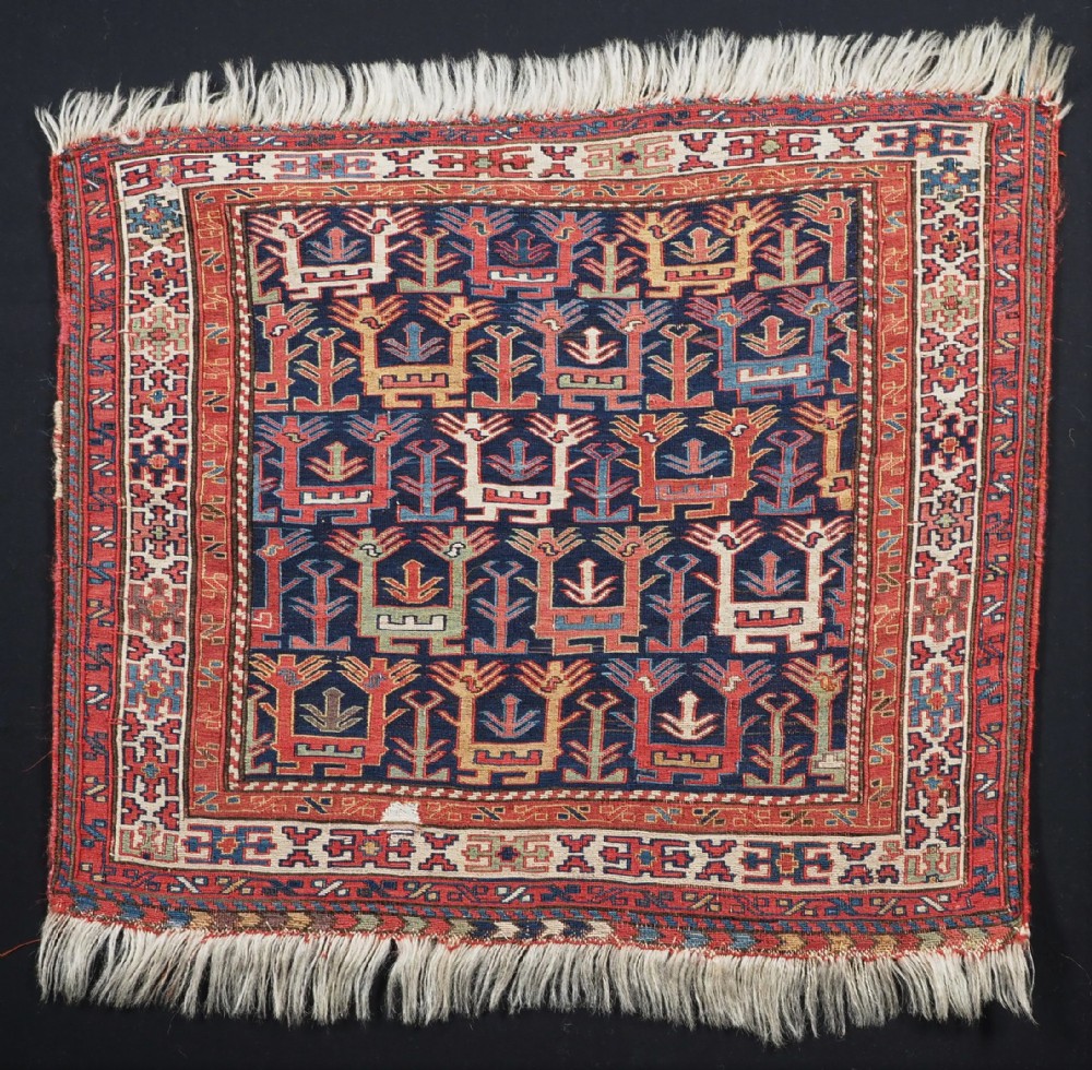 ANTIQUE SHAHSAVAN SOUMAK BAG FACE WITH BIRD DESIGN, MID 19TH CENTURY.